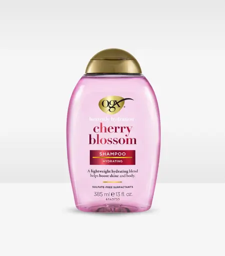 OGX Heavenly Hydration Cherry Blossom Shampoo 385ml bottle with cherry blossom flowers
